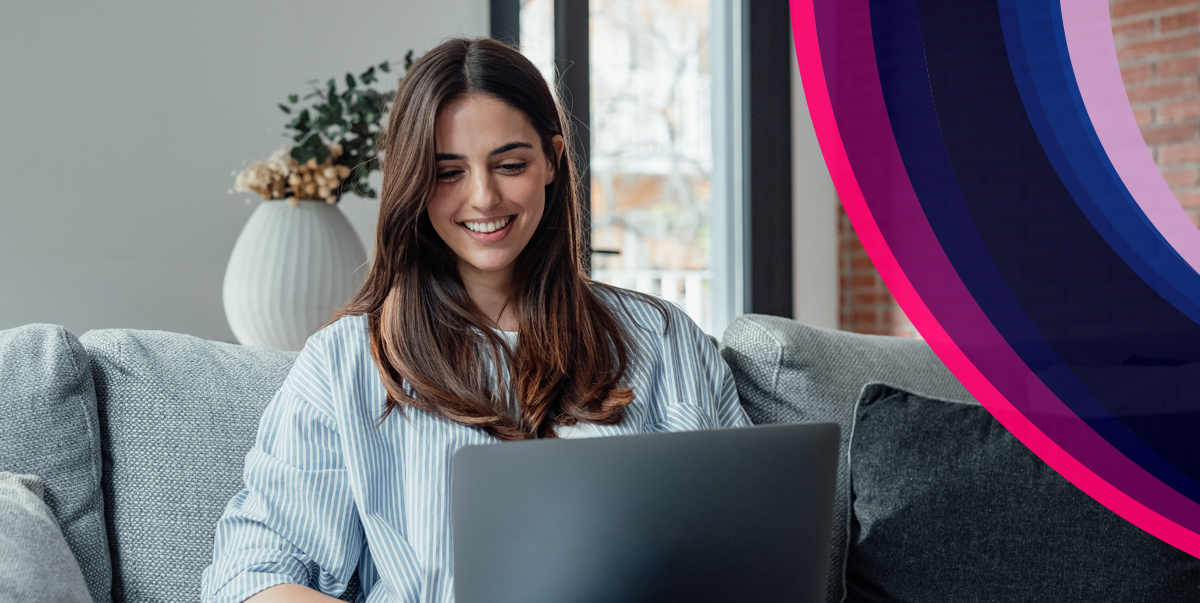 Young woman using a laptop on a sofa